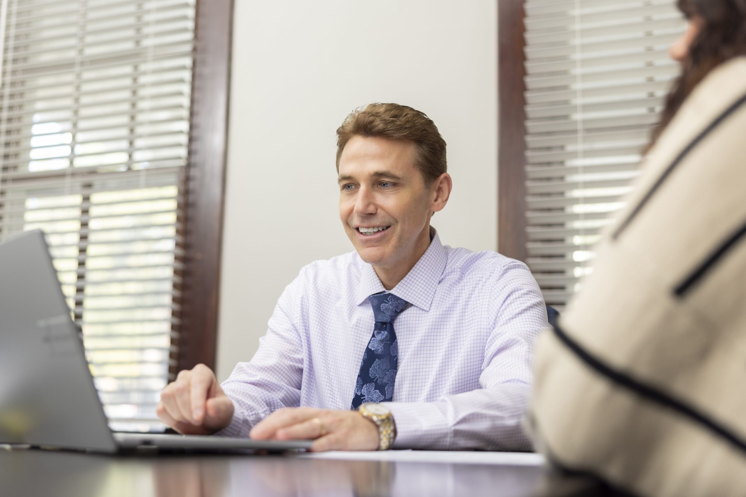 personal injury lawyer Atty. Ryan Cardoso talking to a client in his office